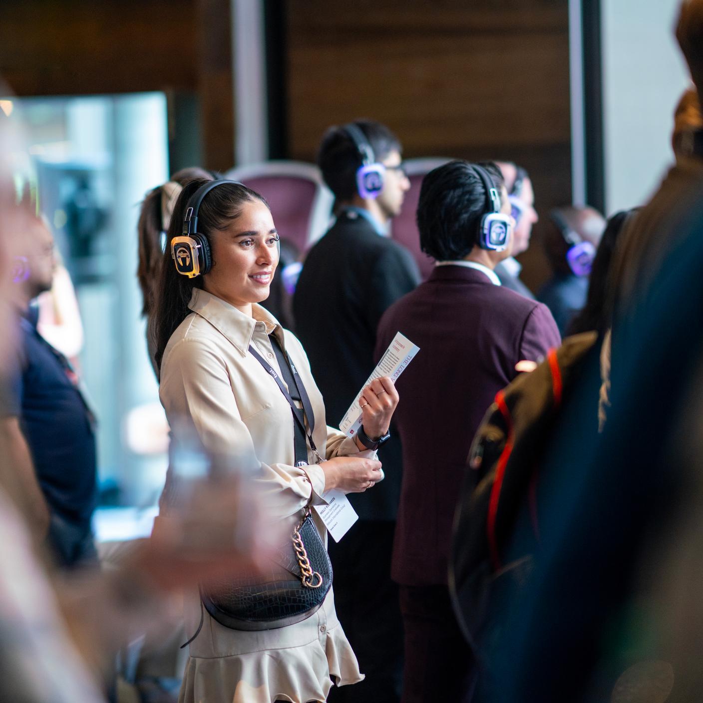 young woman wearing headset at an event