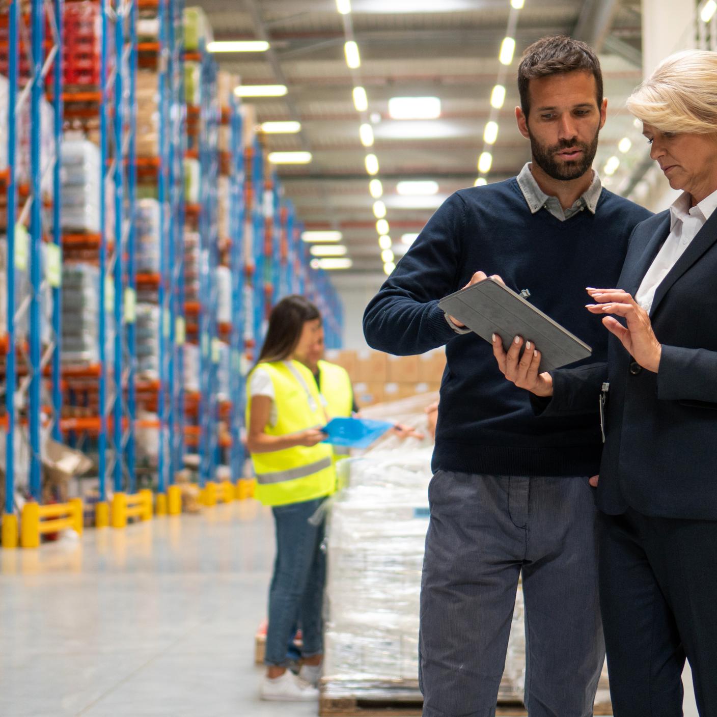 Managers in Warehouse discuss about business