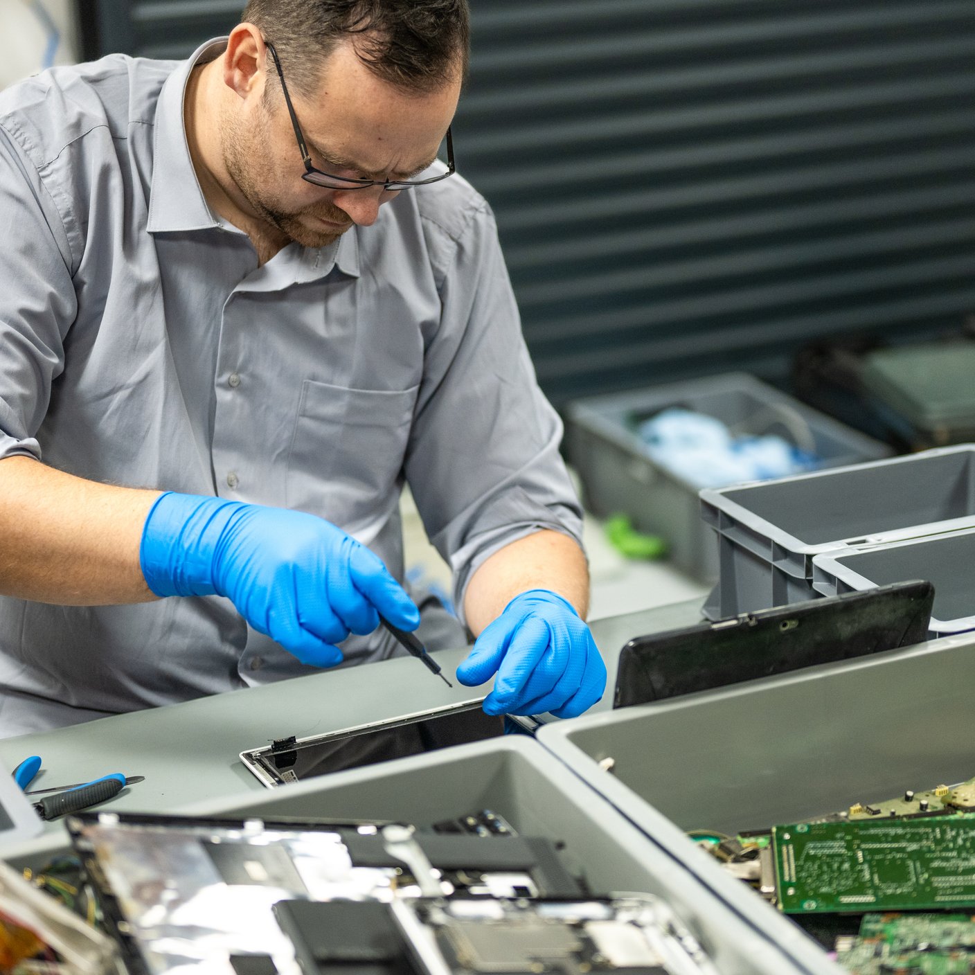 man fixing laptop 