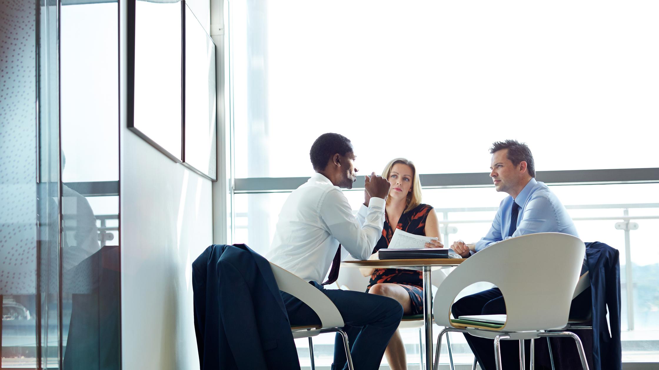 Female business continuity consultants planning strategy in a meeting at creative office